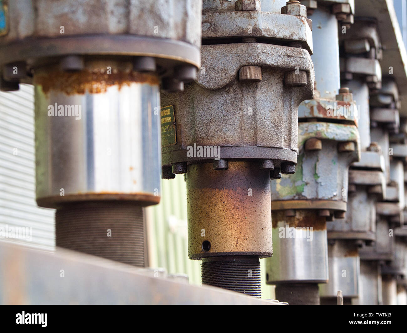 hydraulic press with a number of cylinders Stock Photo Alamy