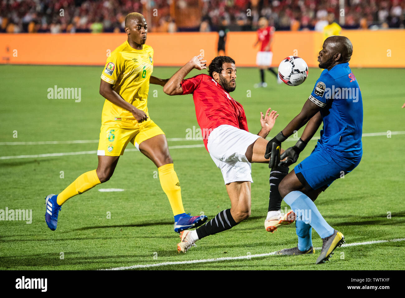 CAIRO, EGYPT - JUNE 21: Marwan Mohsen Fahmy Tarwat of Egypt challenge Edmore Sibanda of Zimbabwe duing the 2019 Africa Cup of Nations Group A match between Egypt and Zimbabwe at Cairo International Stadium on June 21, 2019 in Cairo, Egypt. (Photo by Sebastian Frej/MB Media) Stock Photo