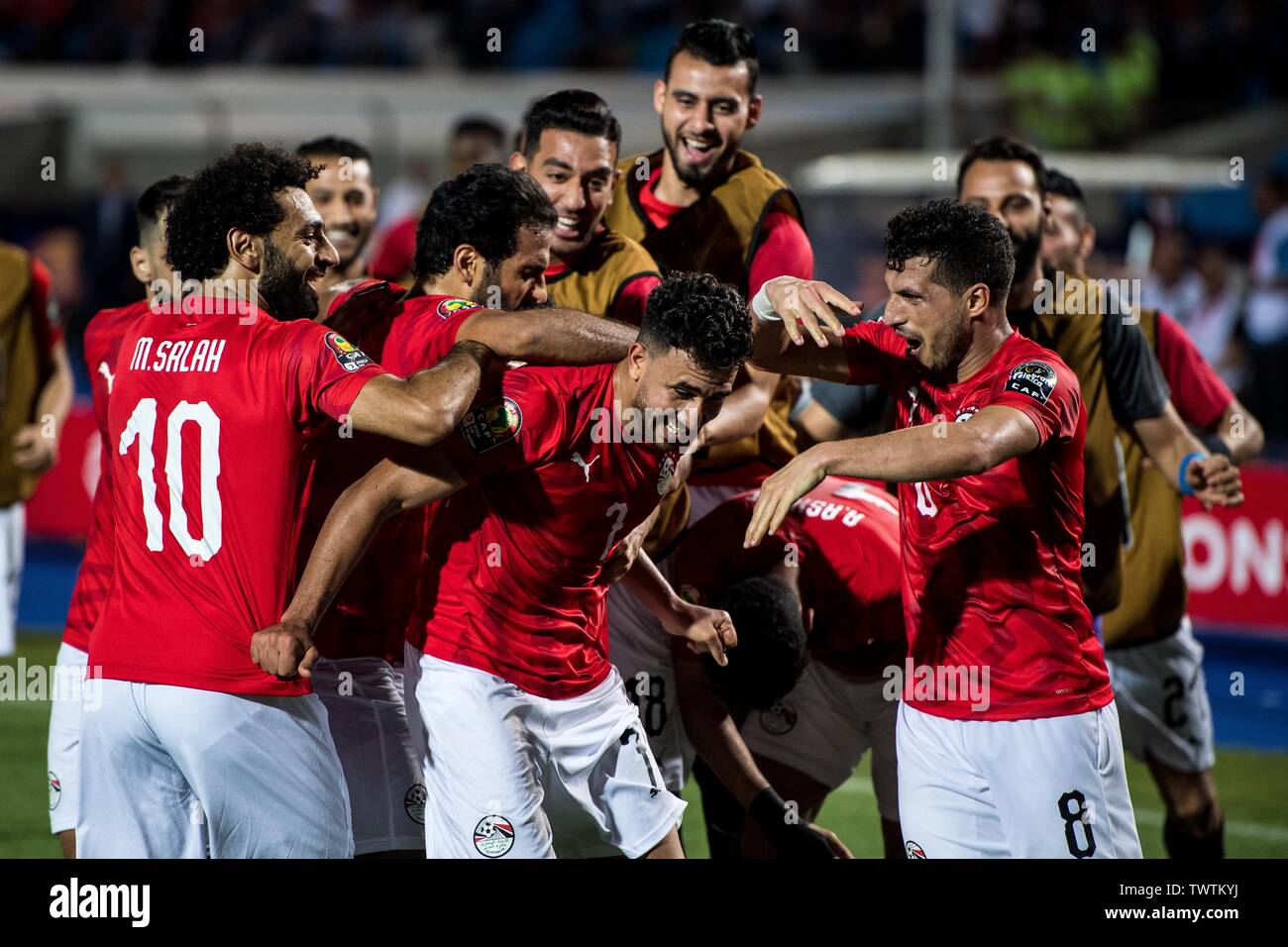 CAIRO, EGYPT - JUNE 21: Mahmoud Hassan Trezeguet of Egypt celebrate with his team mates Ayman Ashraf Elsayed, Mohamed Elneny, Marwan Mohsen Fahmy Tarwat, Mohamed Salah and Abdallah Bekhit after scoring goal during the 2019 Africa Cup of Nations Group A match between Egypt and Zimbabwe at Cairo International Stadium on June 21, 201) Stock Photo