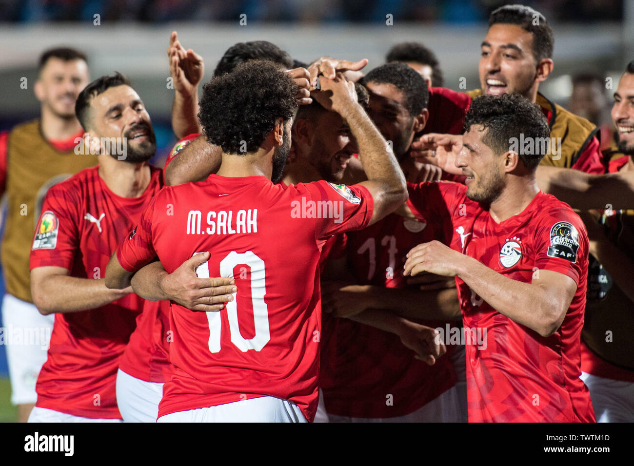 CAIRO, EGYPT - JUNE 21: Mahmoud Hassan Trezeguet of Egypt celebrate with his team mates Ayman Ashraf Elsayed, Mohamed Elneny, Marwan Mohsen Fahmy Tarwat, Mohamed Salah and Abdallah Bekhit after scoring goal during the 2019 Africa Cup of Nations Group A match between Egypt and Zimbabwe at Cairo International Stadium on June 21, 2019 in Cairo, Egypt. (Photo by Sebastian Frej/MB Media) Stock Photo