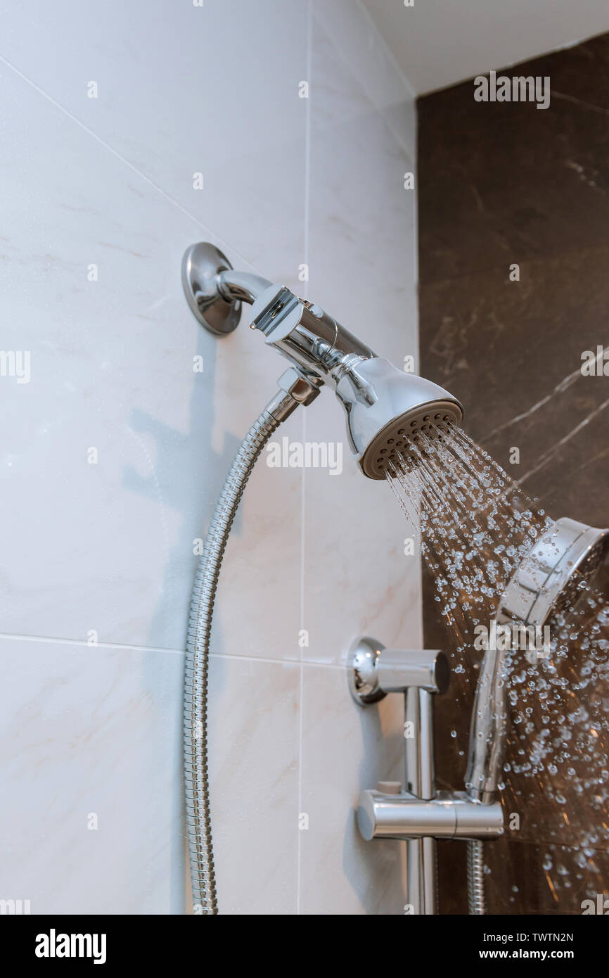 shower head on a bathroom with water drops flowing Stock Photo Alamy