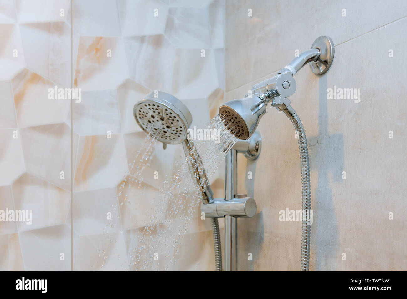 Running water of shower faucet in the bathroom Stock Photo Alamy