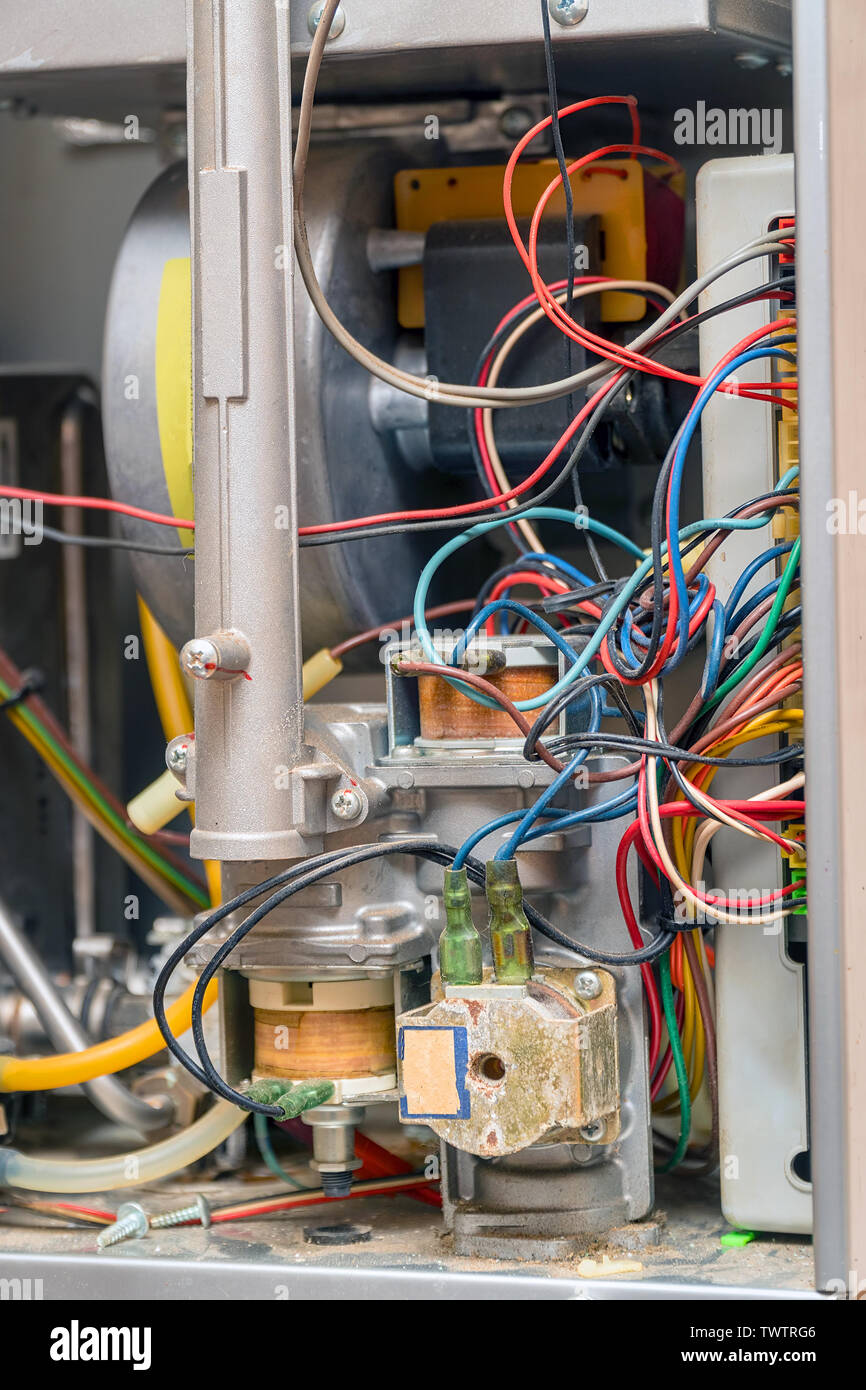 Electrical device with wires. The gas water heater inside. Repair gas