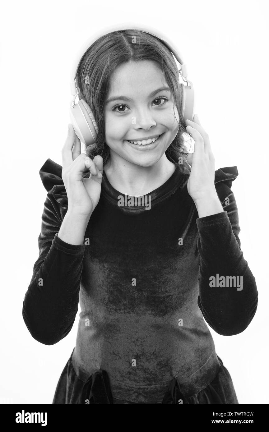 Online music channel. Girl little child use music modern headphones ...