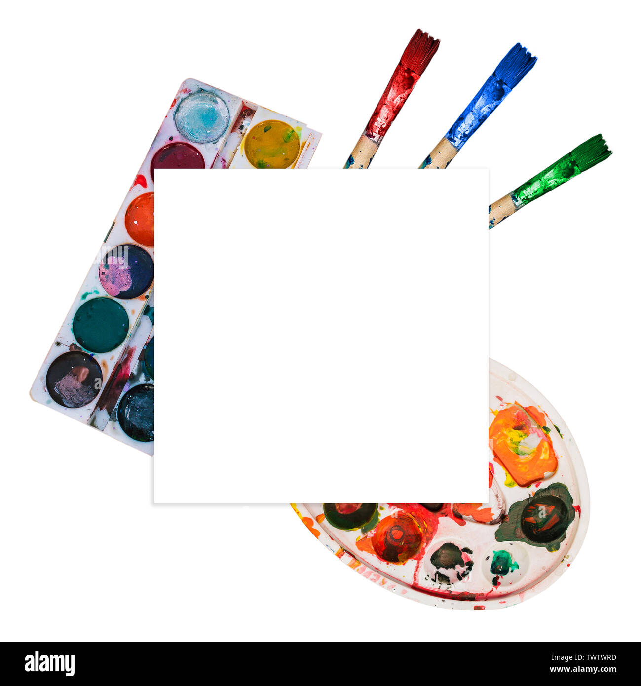 Paint brushes and palettes with different colors of paint. Natural colors, spots on the palette. Template for creativity, art, drawing, education Stock Photo