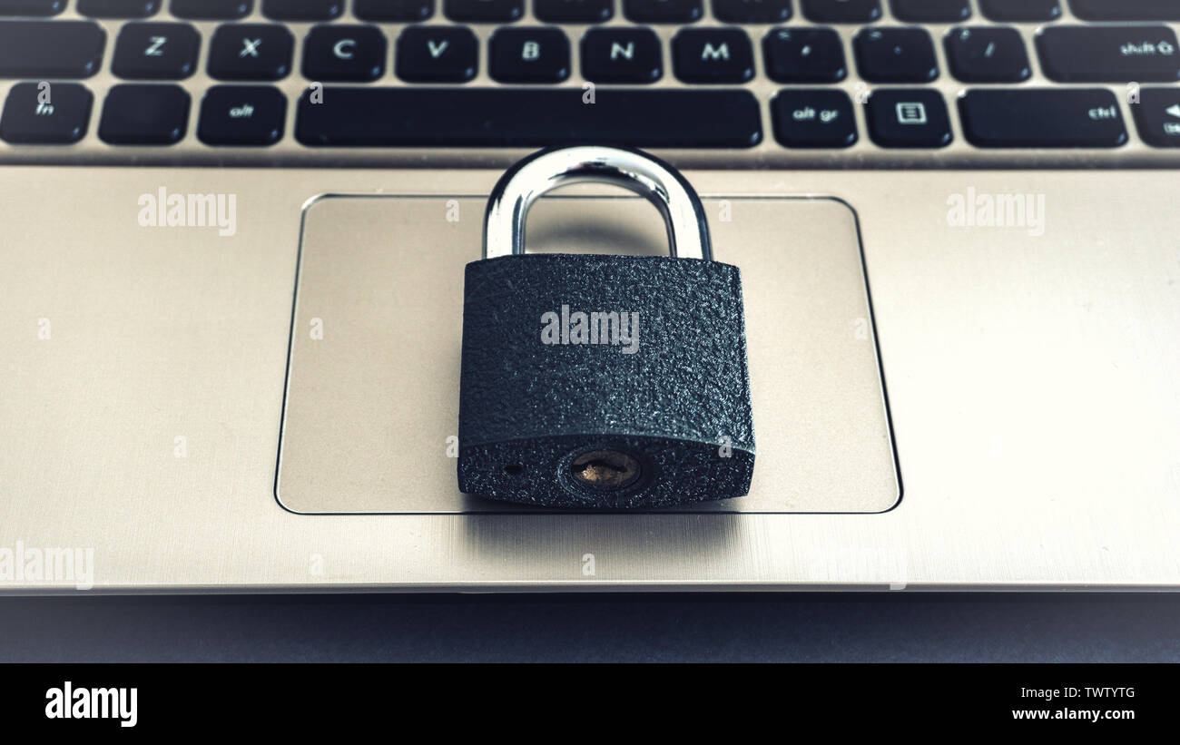Laptop Keyboard With Locker concept photo protected locked virus