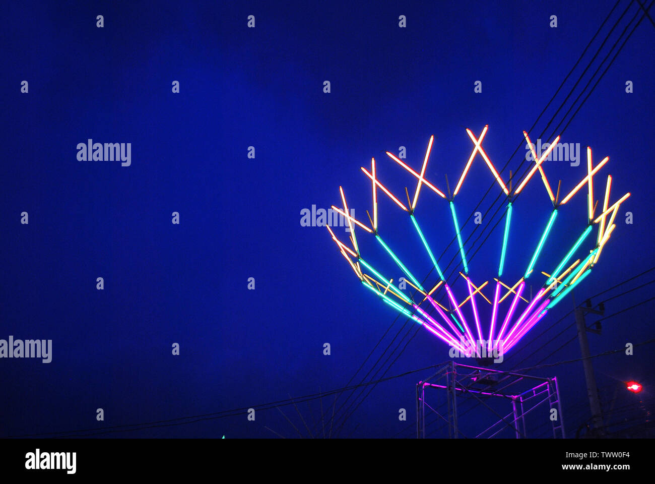 The lights are decorated with neon lights at night with a variety of