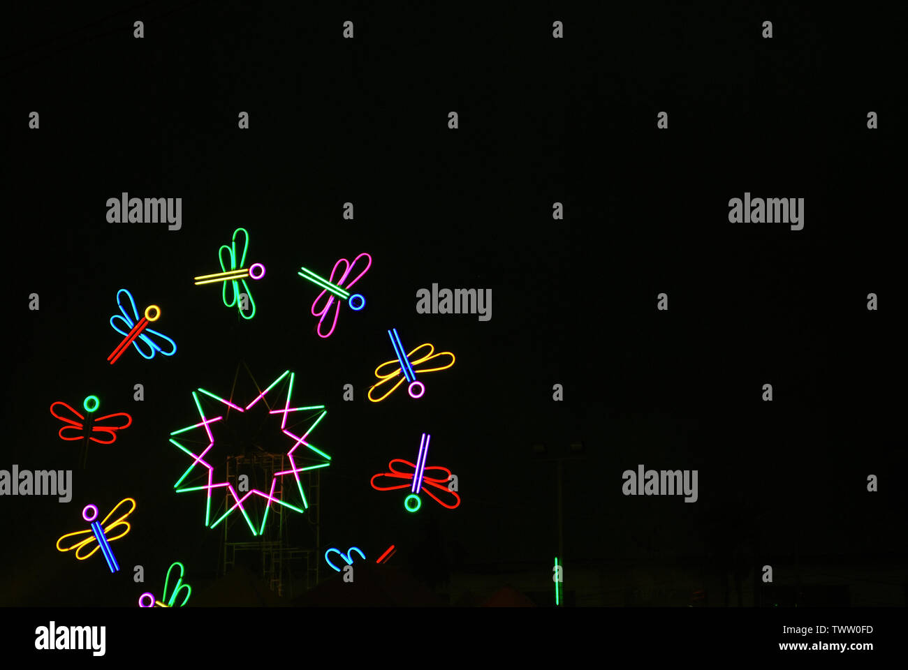 The lights are decorated with neon lights at night with a variety of