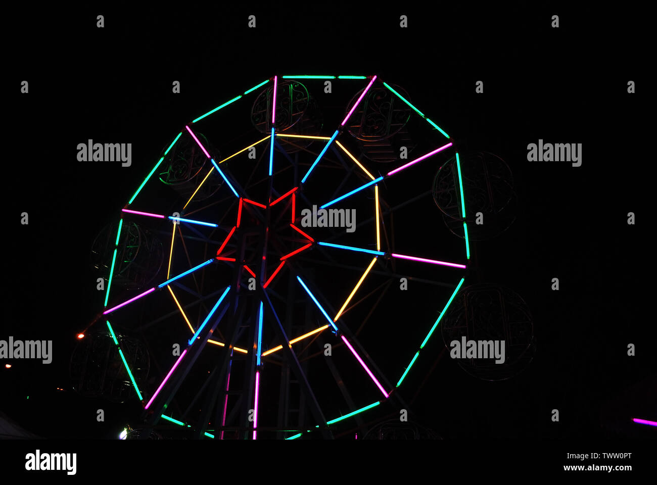 The lights are decorated with neon lights at night with a variety of