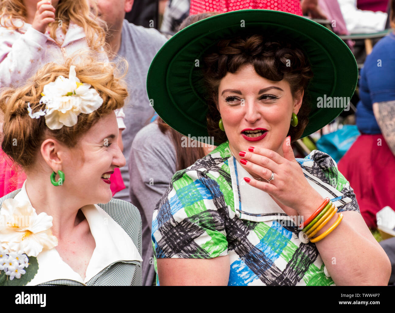 Women wearing 1940s style clothing in Valley Gardens on 1940s Day, Harrogate, England, UK, 23rd June 2019. Stock Photo
