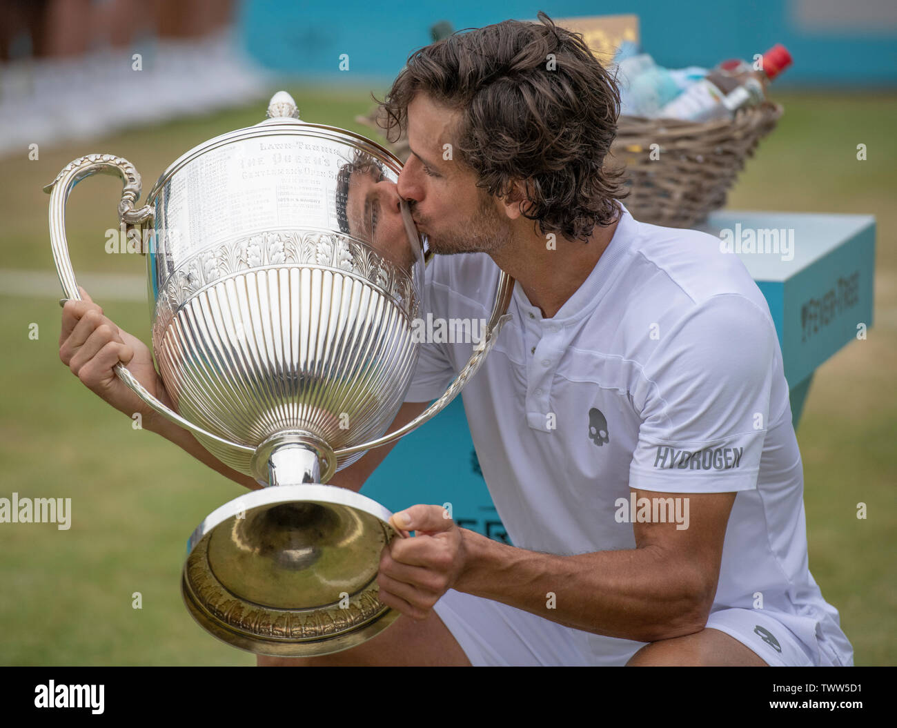 The Queens Club, London, UK. 23rd June 2019. Day 7 of The Fever Tree Championships. Feliciano Lopez (ESP) vs Gilles Simon (FRA) in the Singles Final, Lopez takes the trophy Credit: Malcolm Park/Alamy Live News. Stock Photo