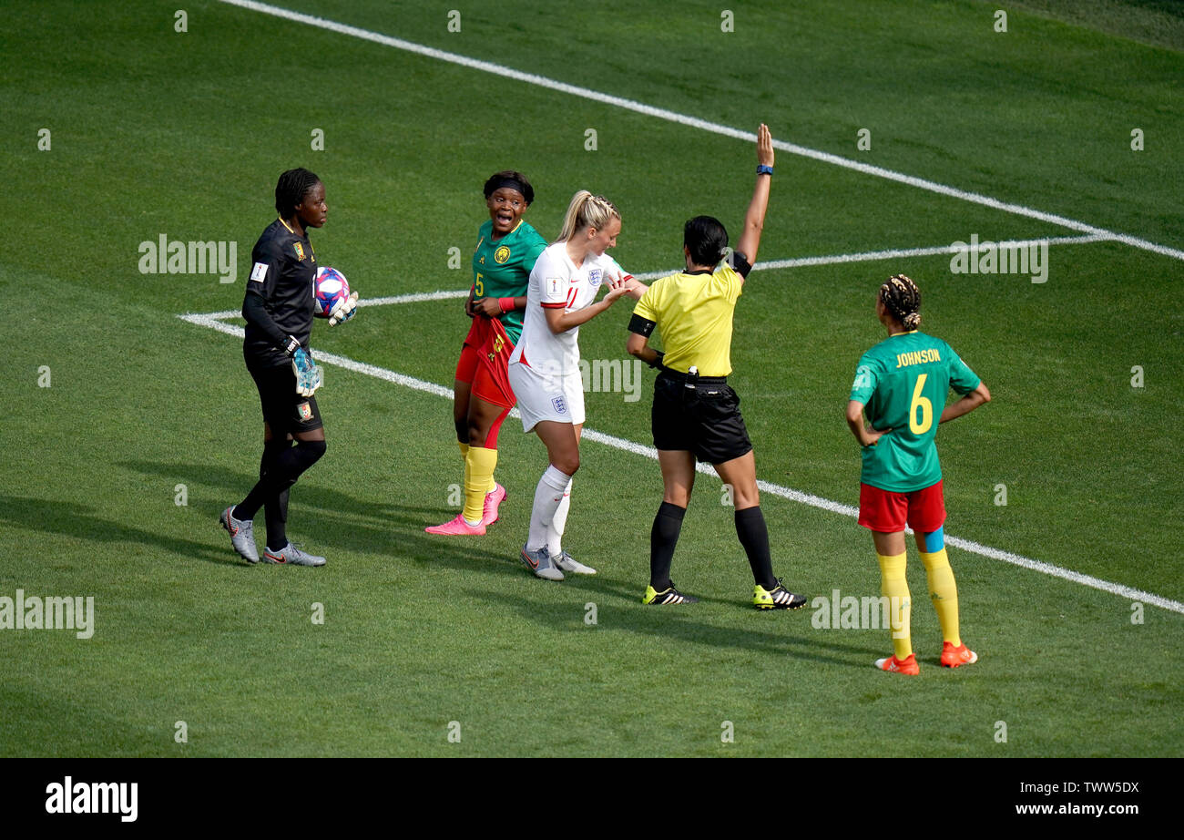 Match referee Qin Liang (second right) awards a free-kick to England in the penalty area after a back pass by Cameroon's Augustine Ejangue (second left) during the FIFA Women's World Cup, round of Sixteen match at State du Hainaut, Valenciennes. Stock Photo