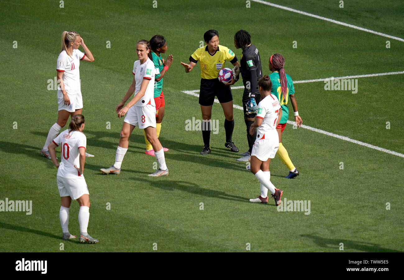 Match referee Qin Liang (fourth right) awards a free-kick to England in the penalty area after a back pass by Cameroon's Augustine Ejangue (fourth left) during the FIFA Women's World Cup, round of Sixteen match at State du Hainaut, Valenciennes. Stock Photo