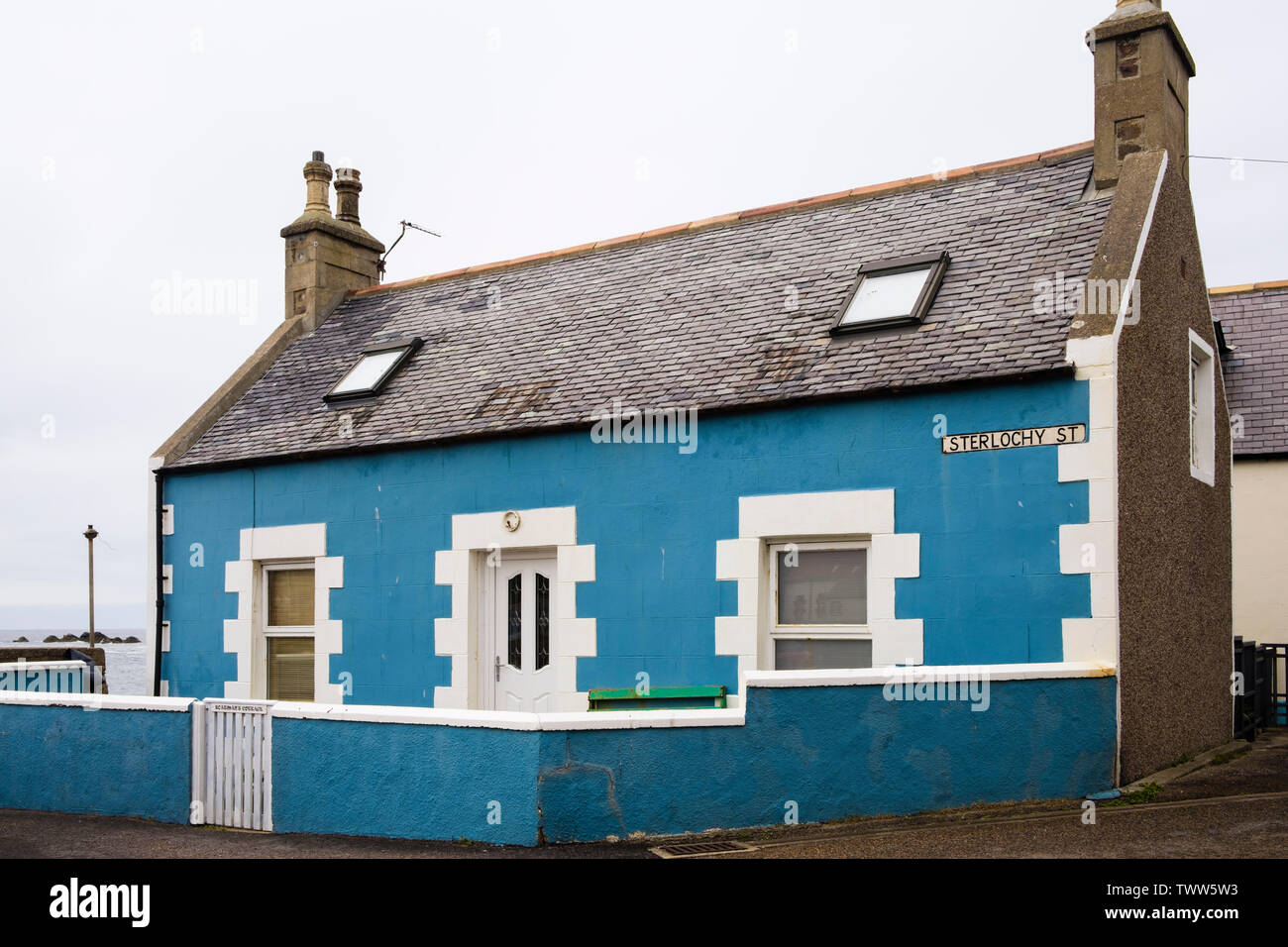 Boatman's Cottage a traditional single story small Scottish house in fishing village of Findochty, Moray, Scotland, UK, Britain Stock Photo