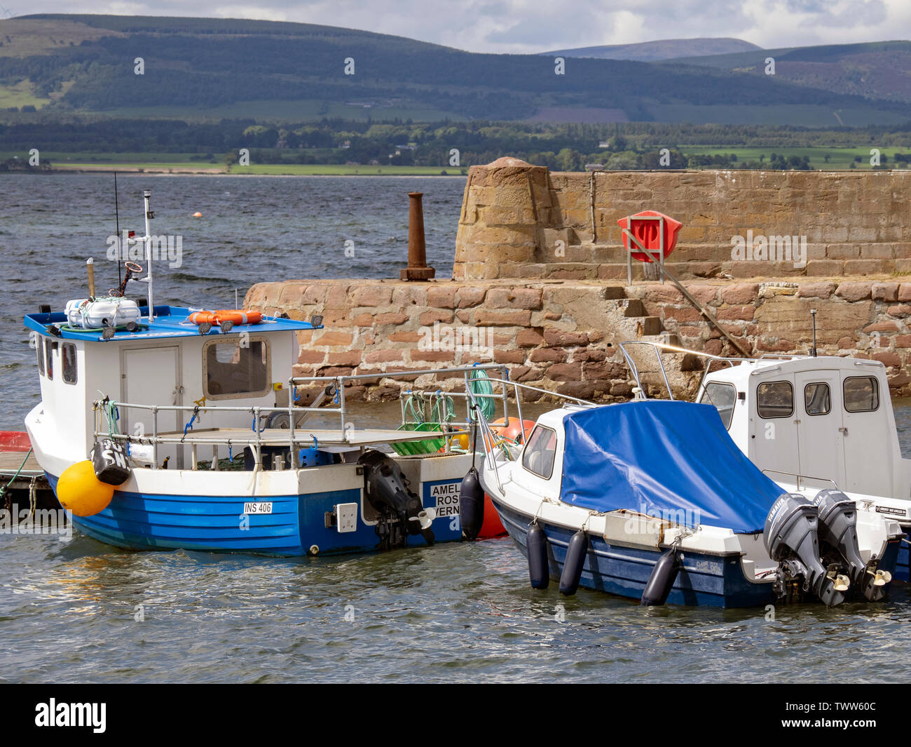 Boats in Cromarty Harbour on a sunny day, Cromarty, Black Isle, Ross and Cromarty, Scotland, United Kingdom. Stock Photo