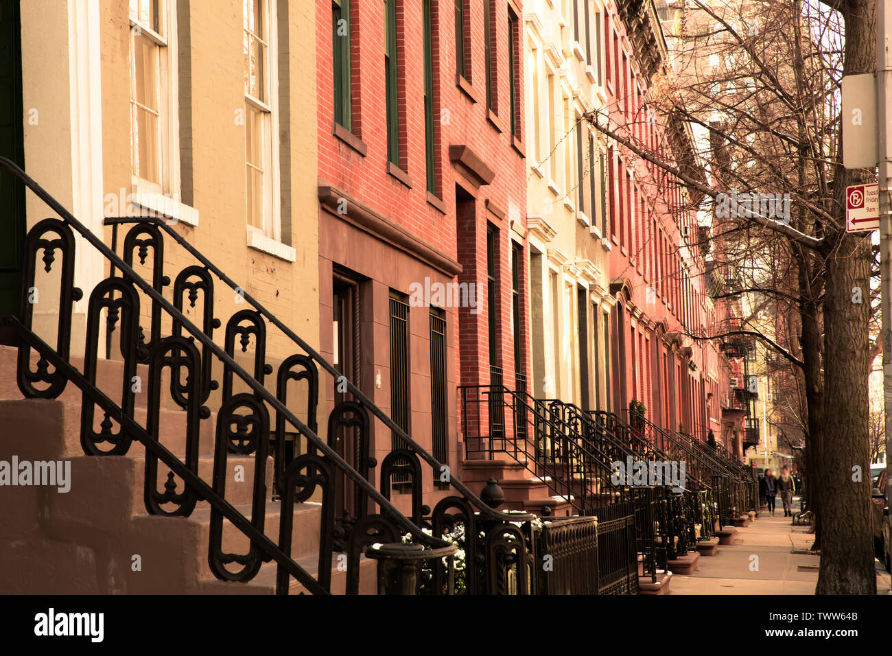 Row of lovely brick and brownstone New York City apartments seen from
