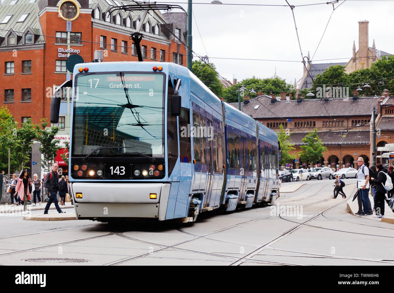Oslo, Norway - June 20, 2019: Front view of a class SL95 low-floor articulated tram at Jernbanetorget in service on line 17. Stock Photo