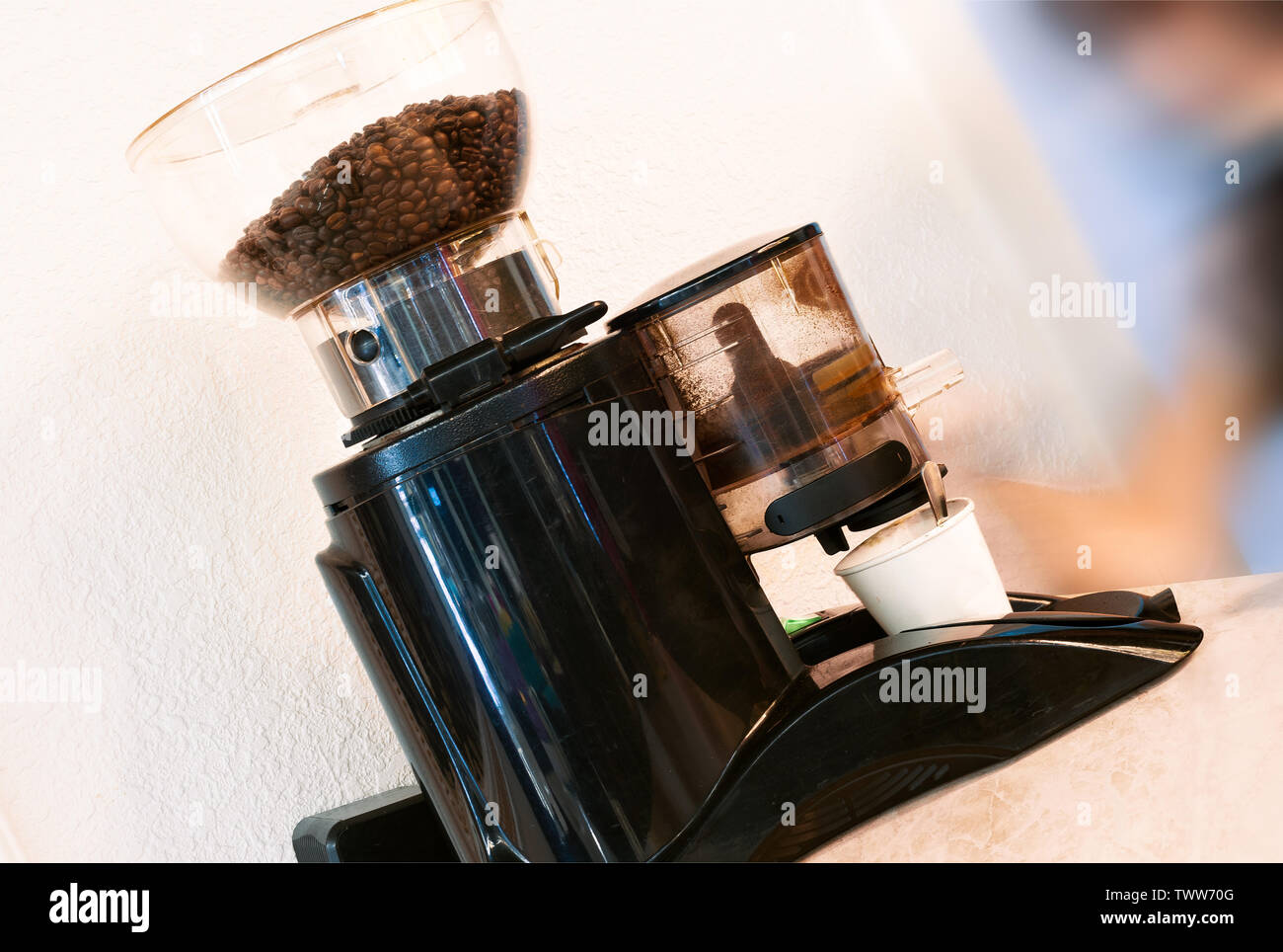 barista with the professional coffee grinder Stock Photo Alamy