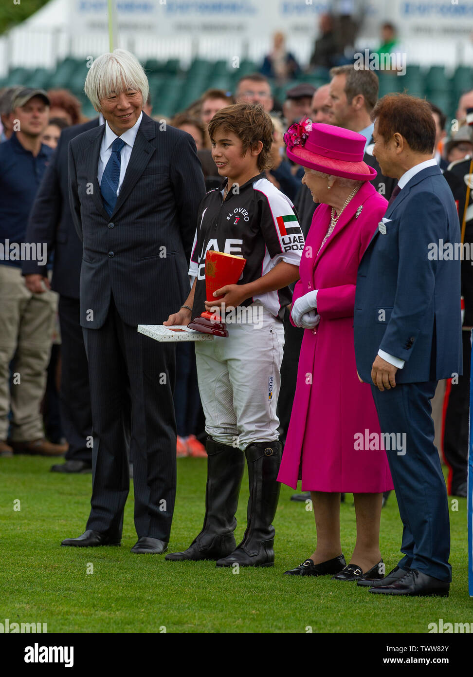 Windsor Great Park, Egham, Surrey, UK. 23rd June 2019. The player of the match in the Outsourcing! Inc Royal Windsor Cup Final, Lucas Monteverde Jnr, poses for a photograph with Her Majesty the Queen after the Guards Polo Club. Credit: Maureen McLean/Alamy Live News Stock Photo