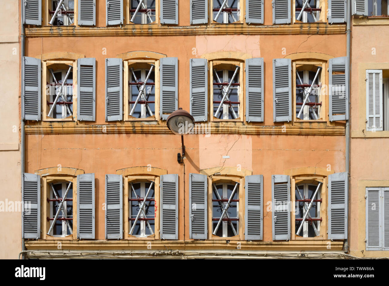 Dangerous Building, Closed on orders of the Municipality, With Windows Reinforced with Scaffolding & Cross Bracing in the Old Town Aix-en-Provence Stock Photo