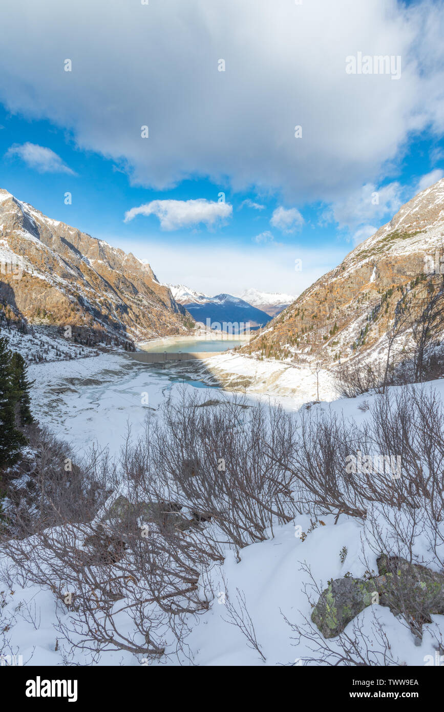 Views of the frozen valley of Lake Avio and Aviolo in the Adamello Brenta national park, Val Camonica, Italy. Fresh snow covering the ground. Stock Photo