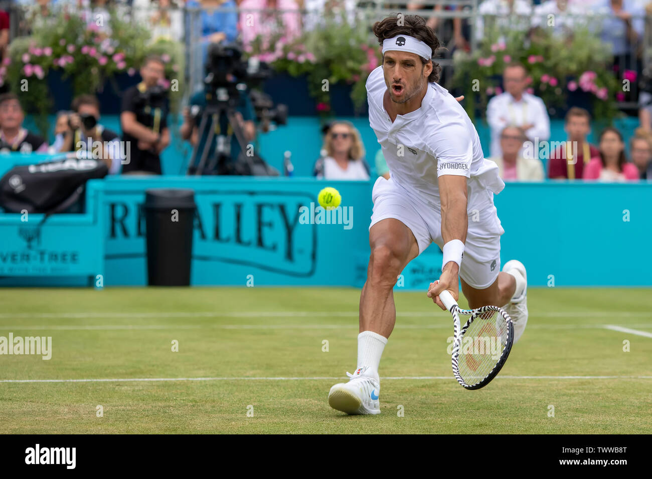 Queens Club, London, UK. 23rd June, 2019. The ATP Fever-Tree Tennis  Tournament; Feliciano Lopez (ESP) with a drop shot in the tie break against  Gilles Simon (FRA) Credit: Action Plus Sports/Alamy Live