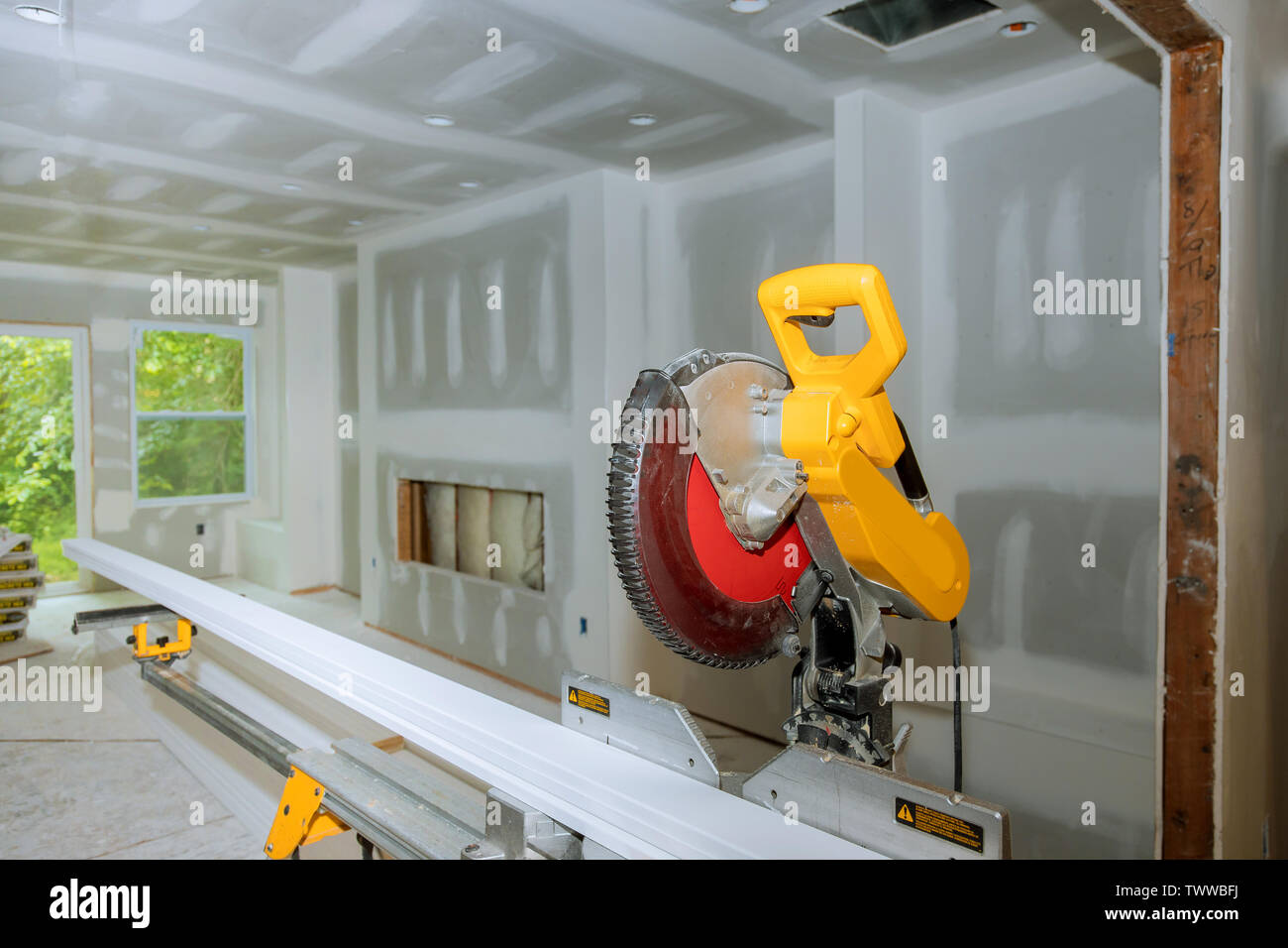 Circular saw cutting wooden base molding new home installing