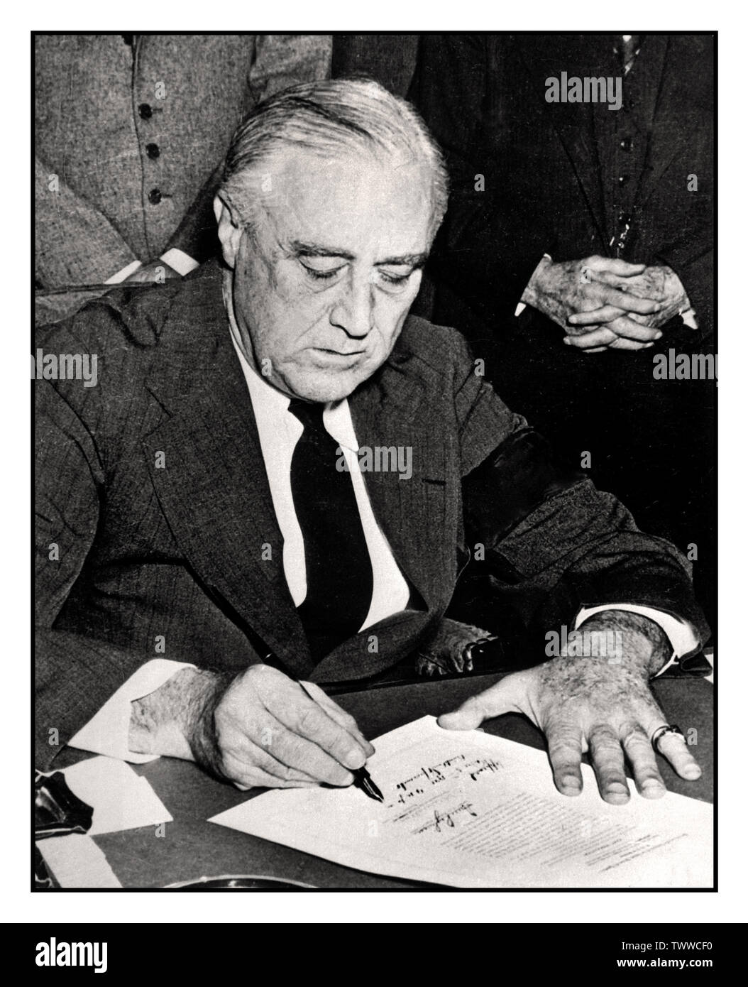 President Franklin D. Rossevelt signing the declaration of war against Japan, December 8, 1941. USA United States did not intervene in WW2 until after Japanese planes bombed Pearl Harbor in 1941. As Japan had an alliance with Germany and Italy, both nations declared war on the United States on December 11th, 1941, four days after the Pearl Harbor attack. Stock Photo