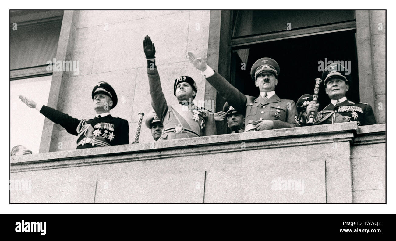 German-Italian military 'Pact of Steel' signing WW2 image of Adolf Hitler, second from the right next to Field Marshall Göring who is holding his official staff of office, shown along with German and Italian army chiefs after having signed the German-Italian military pact in Germany May 22, 1939 Heil Hitler salutes saluting to crowd below Stock Photo