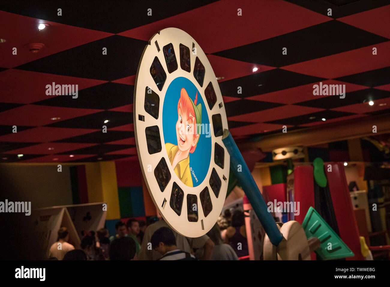 A reel for a ViewMaster with scenes from Disney's Peter Pan with his picture on the front. This area is in a Toy Story ride waiting area. Stock Photo
