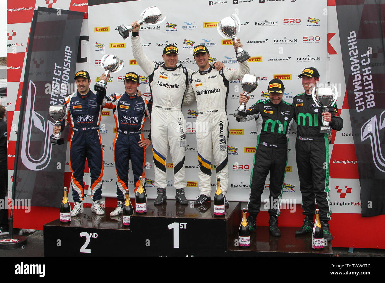 Derby, UK. 23rd June, 2019. Pro Am podium with #1 Multimatic Motorsports Europe drivers Sir Chris Hoy (L) & Billy Johnson (R), #2 Beechdean AMR drivers Kelvin Fletcher (L) & Martin Plowman (R) & #3 Fox Motorsport drivers Mark Murfitt (R) & Michael Broadhurst (L) during the British GT Championship Round 9 at Donington Park, Derby, England on 23 June 2019. Photo by Jurek Biegus. Credit: UK Sports Pics Ltd/Alamy Live News Stock Photo