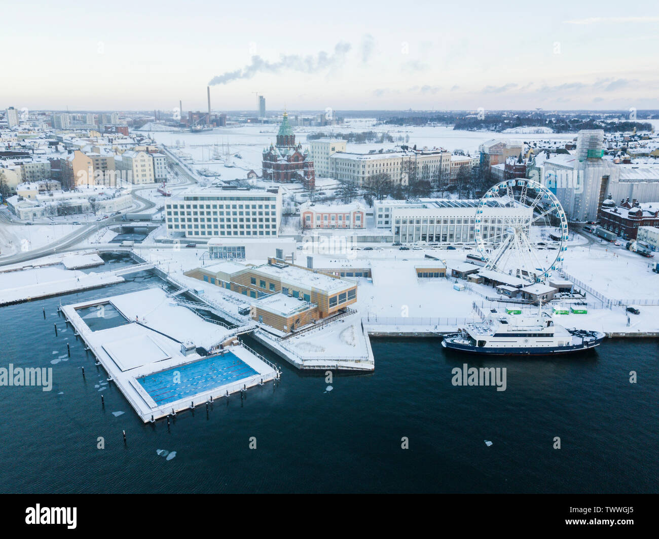 Helsinki, Finland. What you see is the Allas sea pool swimming pool, open all around the year and the Katajanokka district behind it. Stock Photo