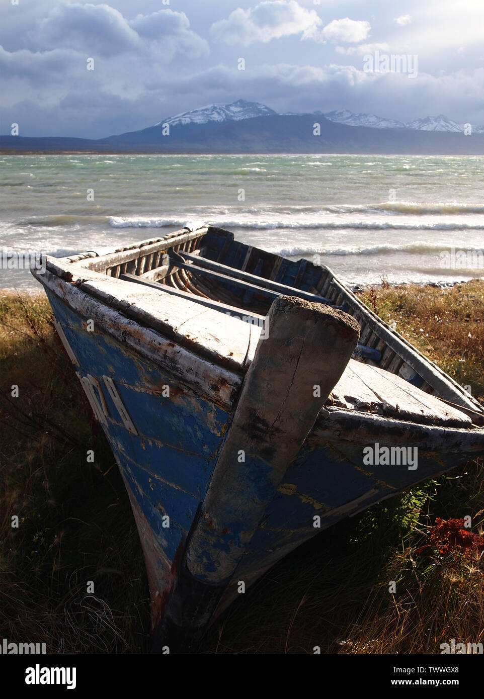 An artisanal fishing boat in Ultima Esperanza Bay, Southern Chile Stock Photo