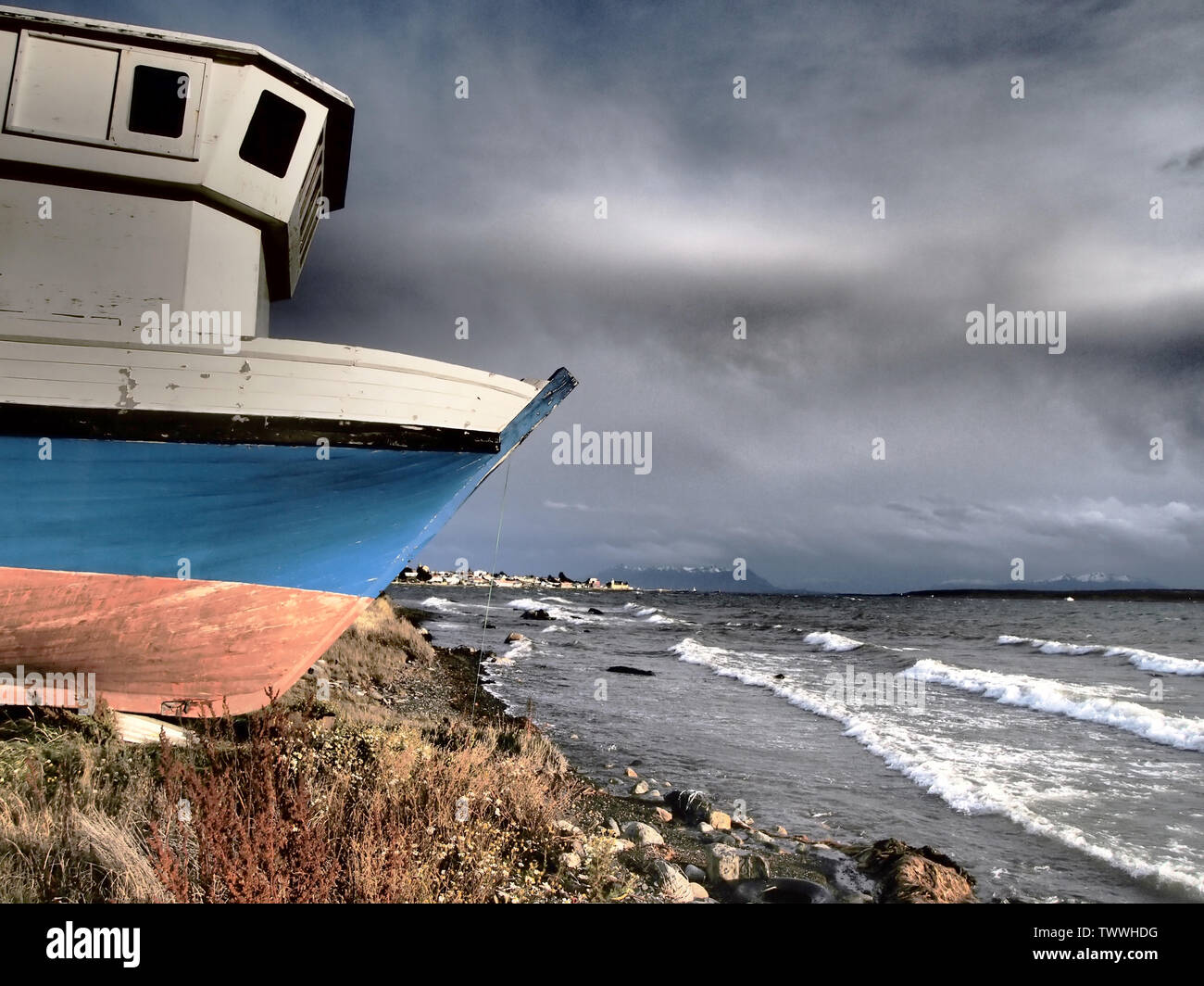 An artisanal fishing boat in Ultima Esperanza Bay, Southern Chile Stock Photo