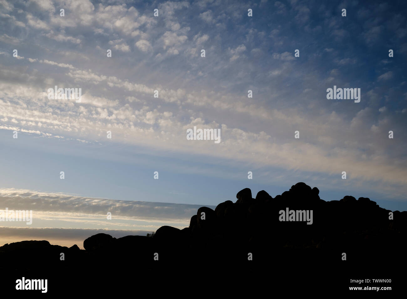 Granite formations silhouetted at sunset. Cáceres province. Extremadura. Spain. Stock Photo