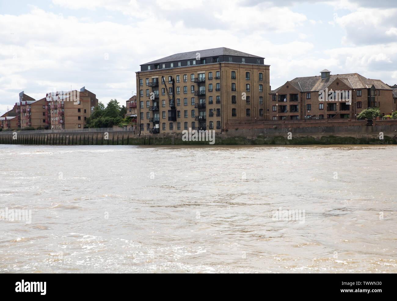 Skyline as seen from the back of a Thames Clipper boat on the River Thames, London Stock Photo