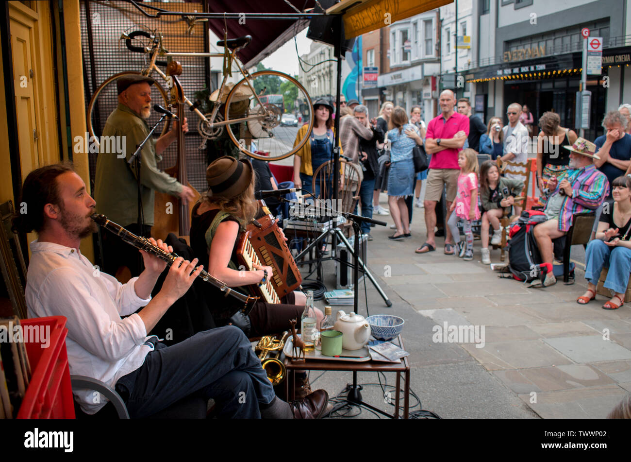 Crystal Palace south London annual street community free festival, musicians playing outside a second hand shop opposite the Everyman Cinema 2019 local people audience 2010s  UK HOMER SYKES Stock Photo