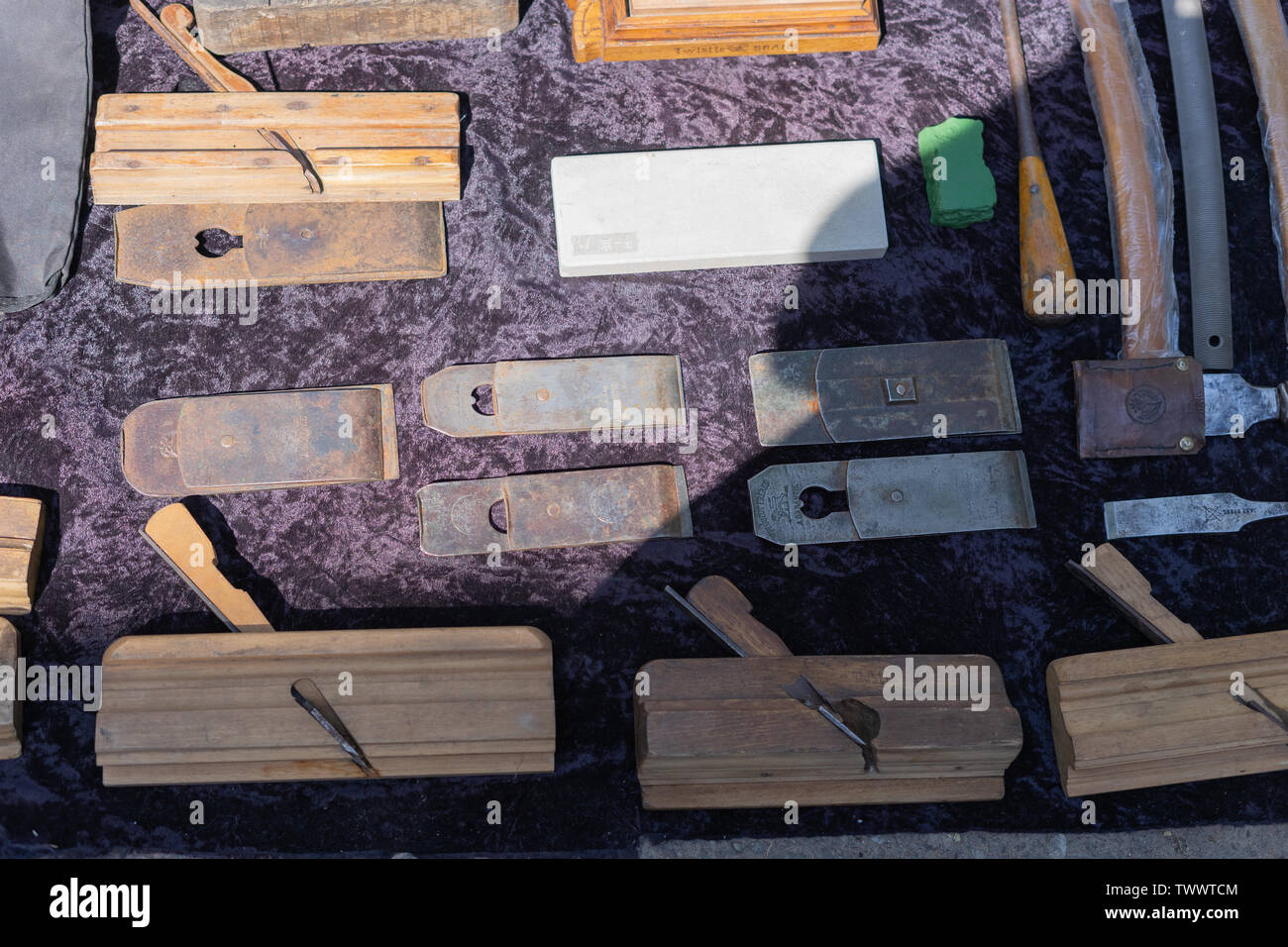 Antique antiques are sold at a flea market.Ancient tool joiner. Wooden