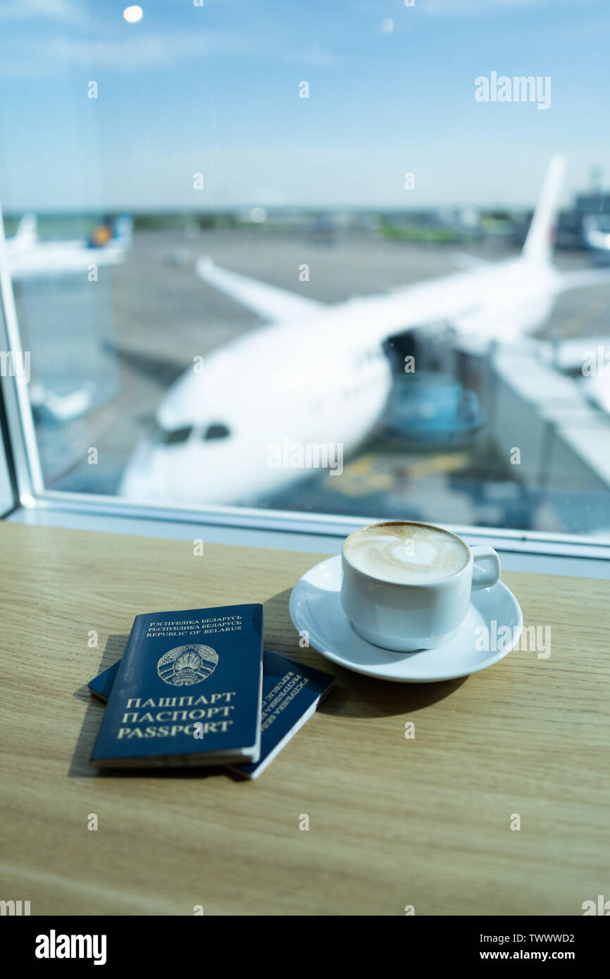 Cup of tea in airport's business lounge with passports. Waiting for the ...