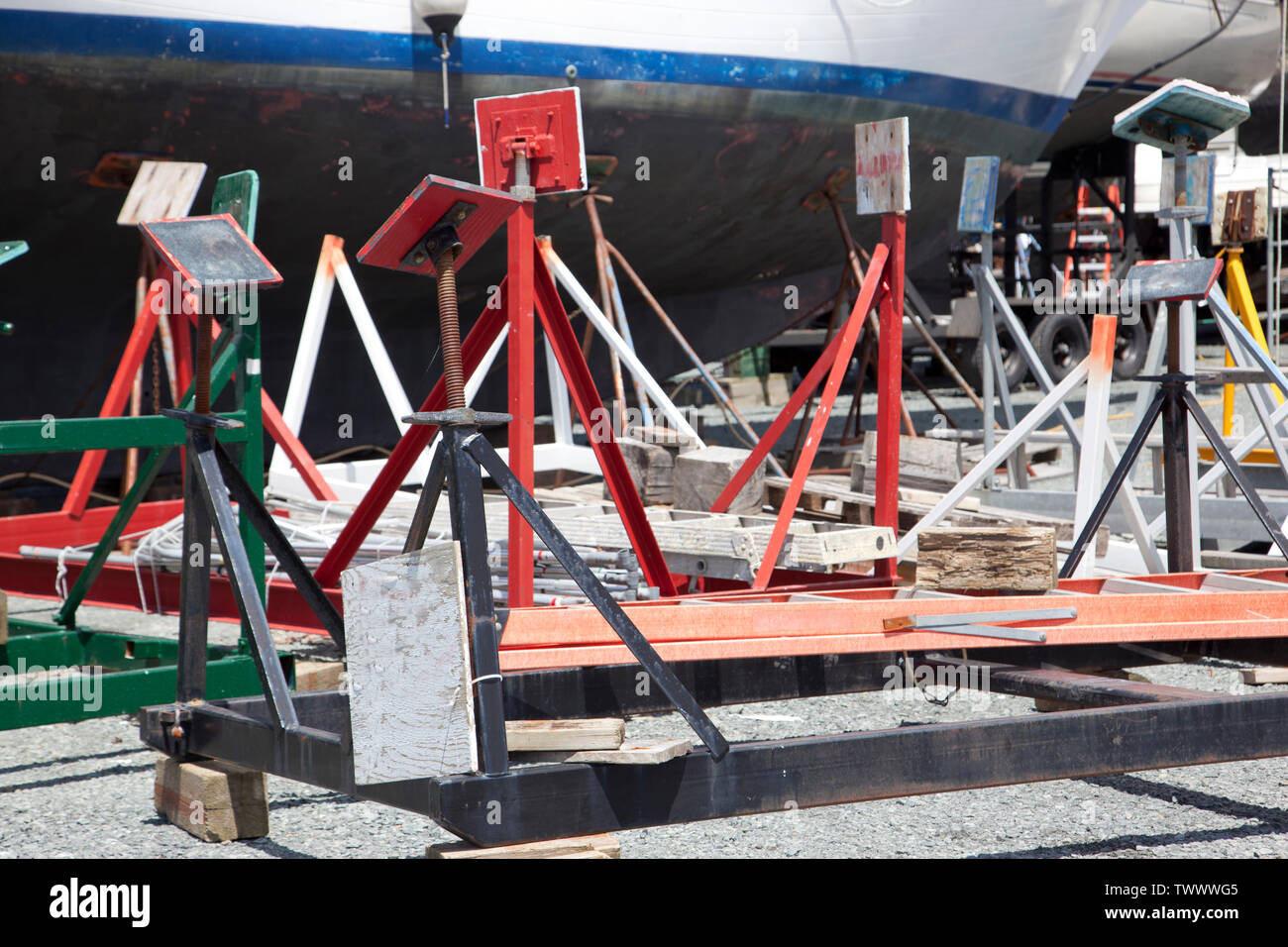 empty wood cradles ready to hold boats or yachts at a marina Stock Photo