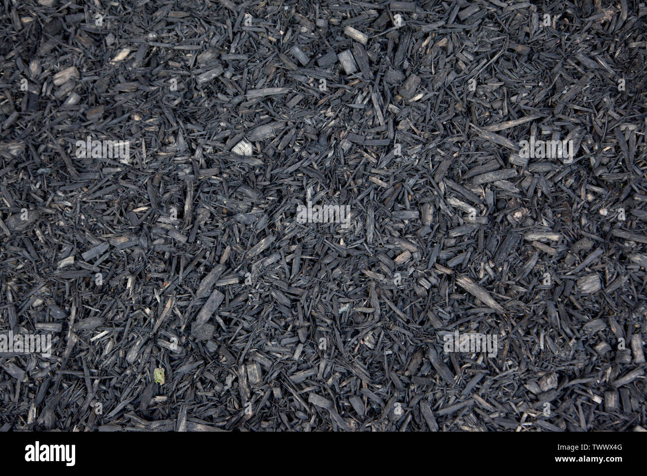 grey coloured chips or dirt make a natural background Stock Photo