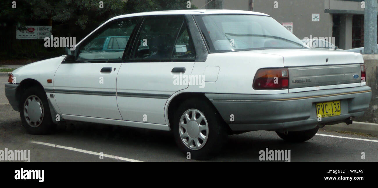 1990 Ford Laser (KF) GL sedan (with a 1996â€“1999 Toyota Corolla (AE101R)  CSi rear-left hubcap). Photographed in Sutherland, New South Wales,  Australia.; 27 December 2008; Own work; OSX Stock Photo - Alamy