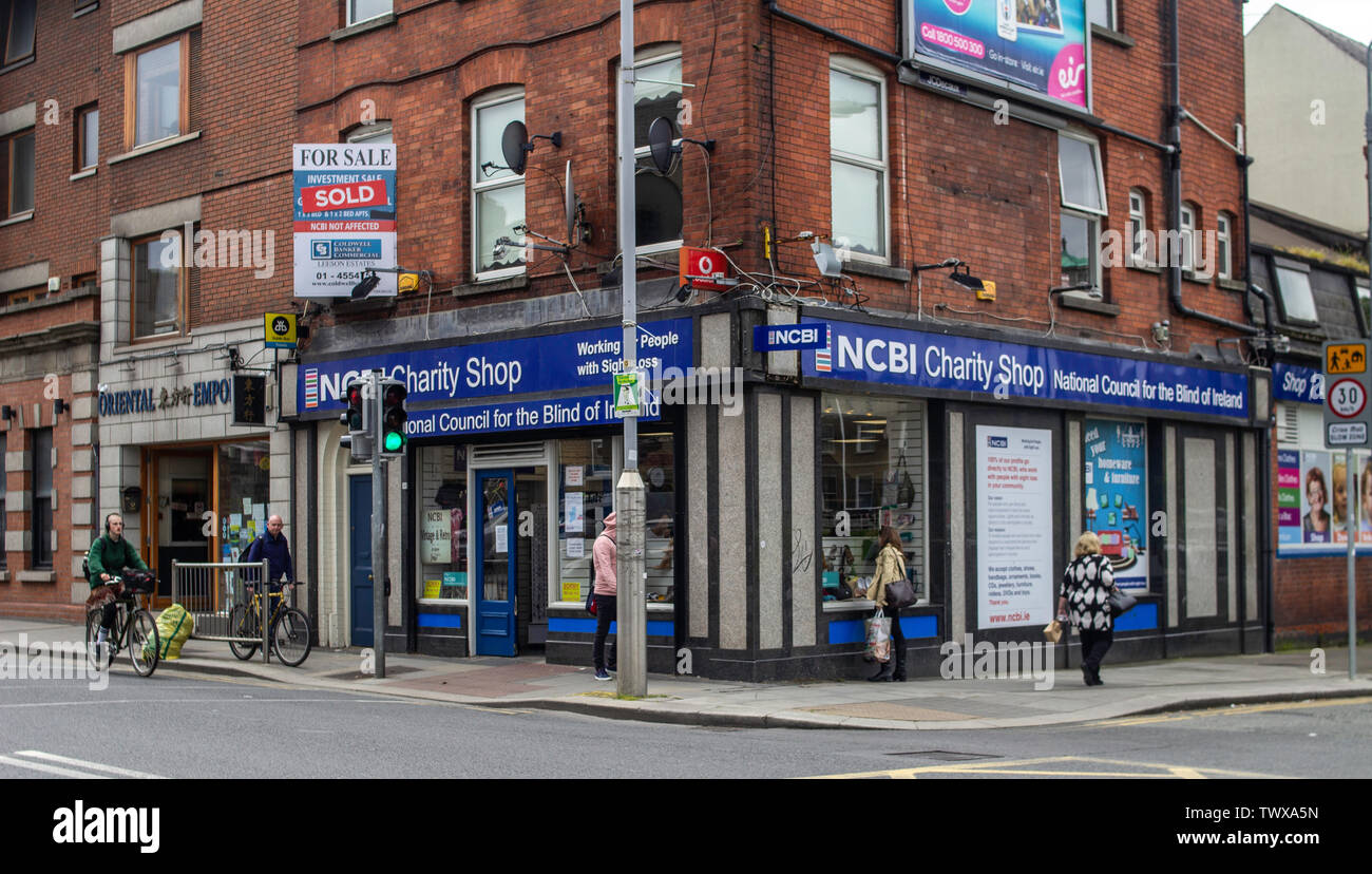 Window shopping at a charity shop in Rathmines, Dublin, Ireland,run by the National Council for the Blind of Ireland Stock Photo