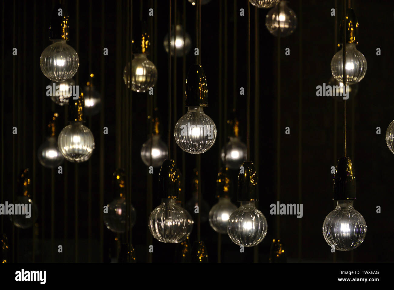 Lighting bulbs on dark background texture background Stock Photo