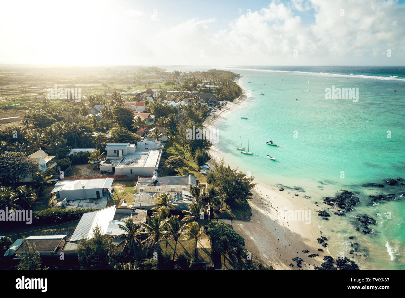 Aerial drone view at luxury resorts and coastline at Belle Mare beach on island Mauritius. Toned image. Stock Photo