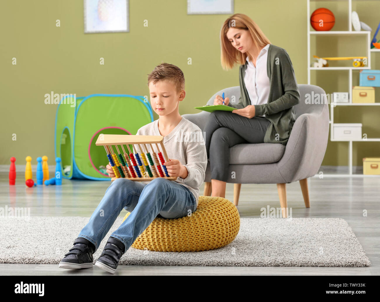 Little boy with autistic disorder at child psychologist's office Stock