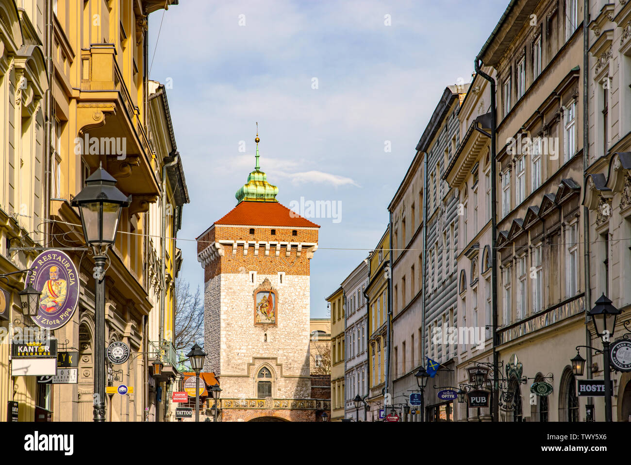 Cracow, Poland – Feb 02, 2019: View at Medieval tower with entrance Gate to Florianska street in the Old Town section of Cracow, Poland UNESCO world H Stock Photo