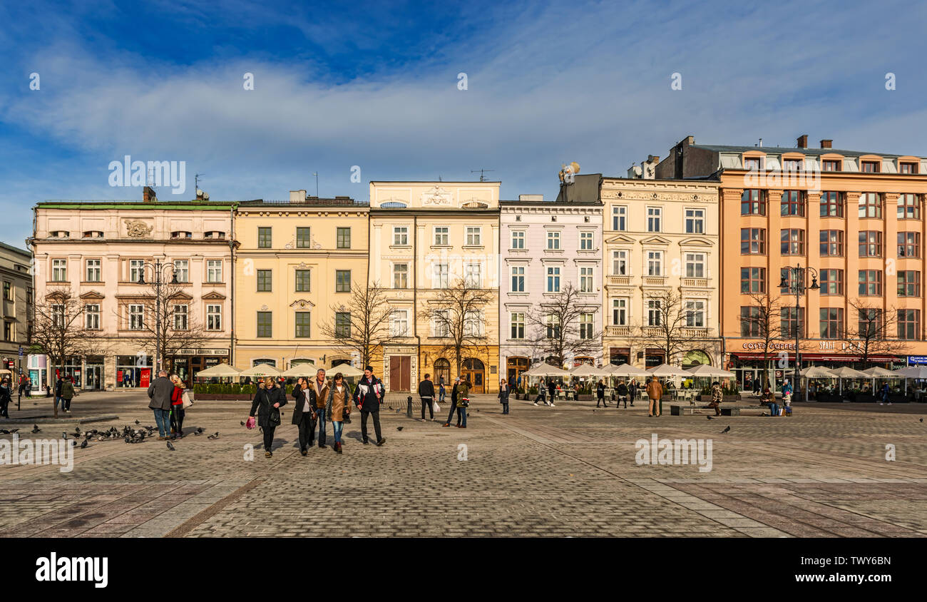 Cracow, Poland – Feb 02, 2019: View at the historic houses in main market square located in old town district of Cracow, Poland. Stock Photo