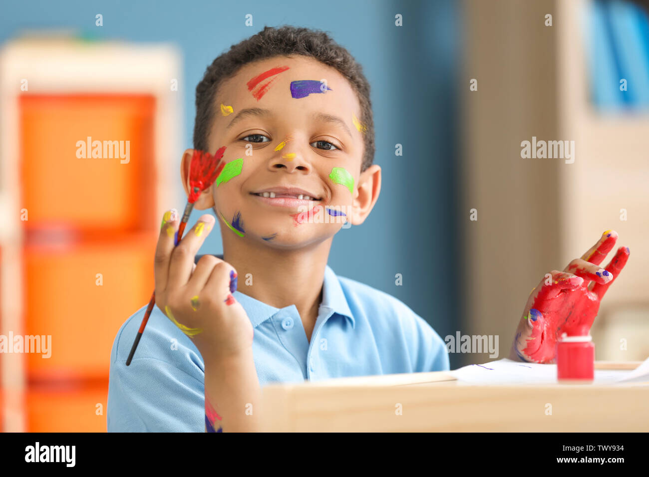 Download Cute African American Boy Painting At Home Stock Photo Alamy