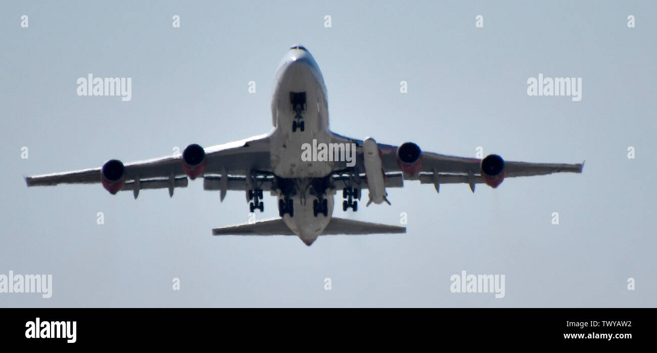Mojave, California, USA. 23rd June, 2019. Virgin Orbit 747 Cosmic Girl takes off for a test run Sunday morning from Mojave airport California, June 23, 2019. Under it's left wing is the LauncerOne rocket that getting ready for it's first test drop this year. The 747 did a series of test of Zoom Climb Maneuvers off the coast of SoCal and will be leading up to the 1st launch test. Photo by Gene Blevins/ZUMAPRESS Credit: Gene Blevins/ZUMA Wire/Alamy Live News Stock Photo